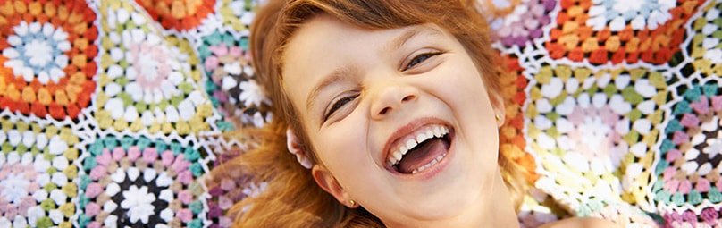 Smiling girl at the dentist